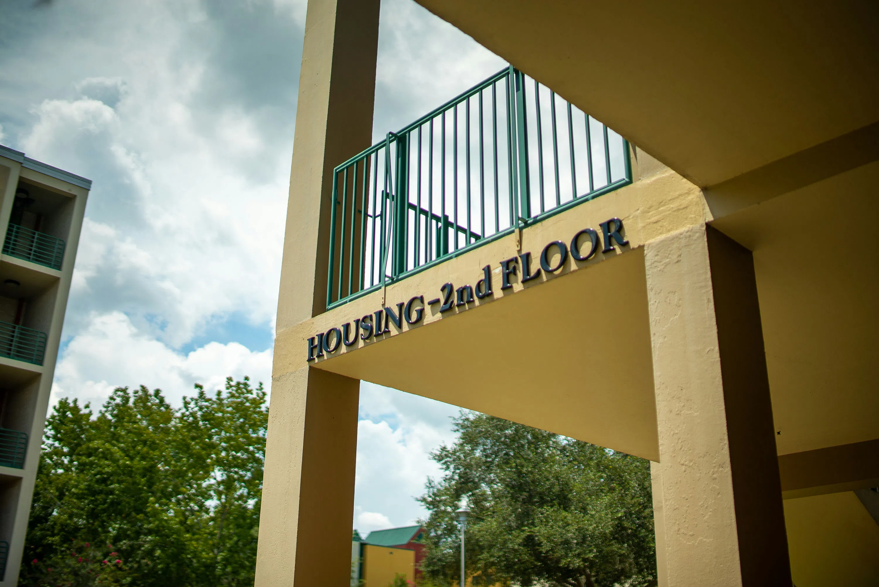 Signage that reads "Housing - 2nd Floor"