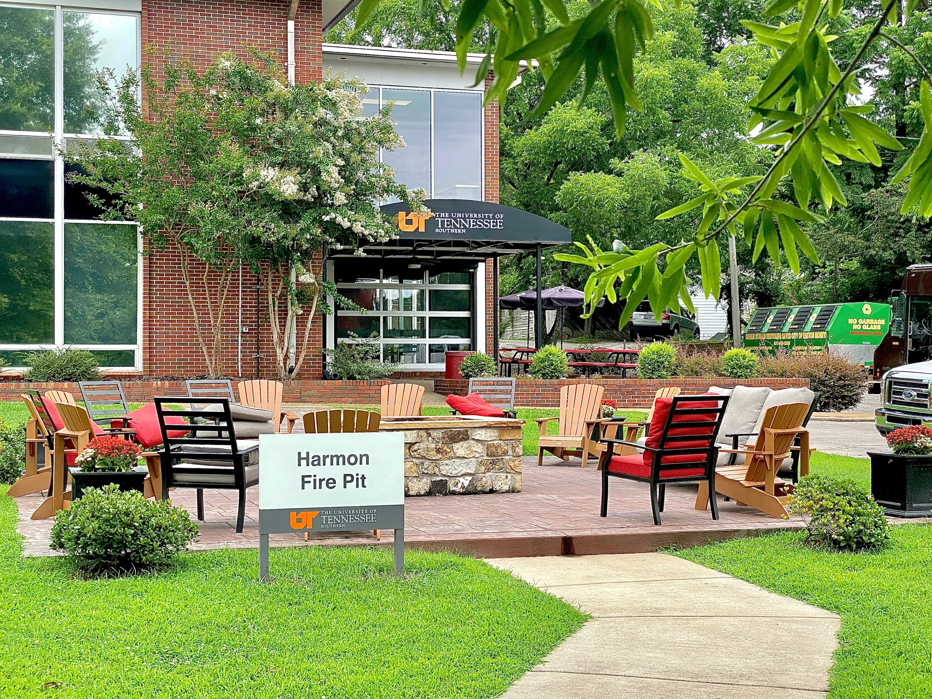 Exterior of Student Union with chairs and Harmon Fire Pit