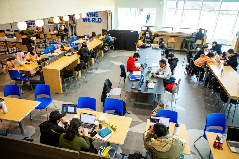 Students sitting inside One World Café