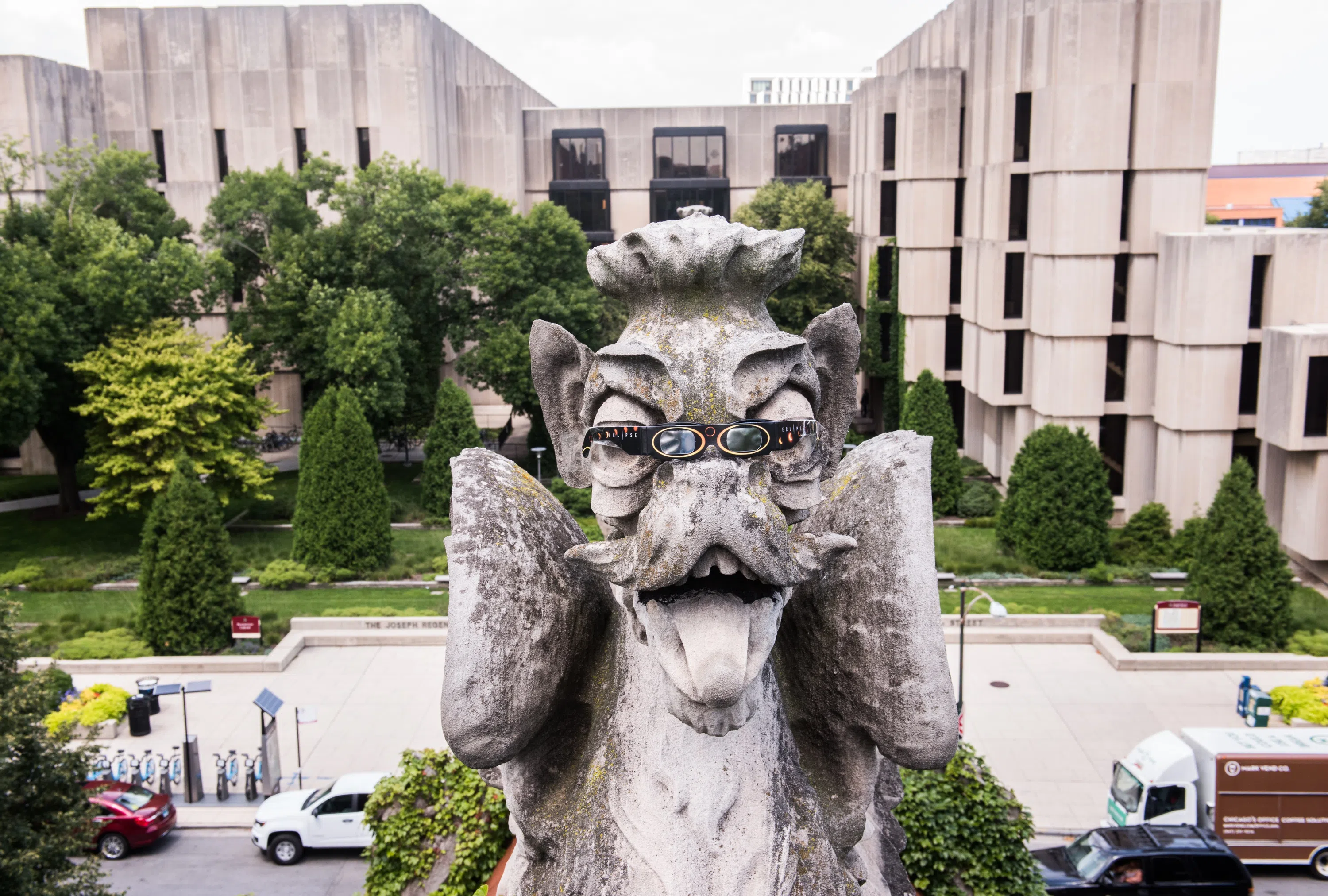 photo of the Regenstein library with a gargoyle in the foreground