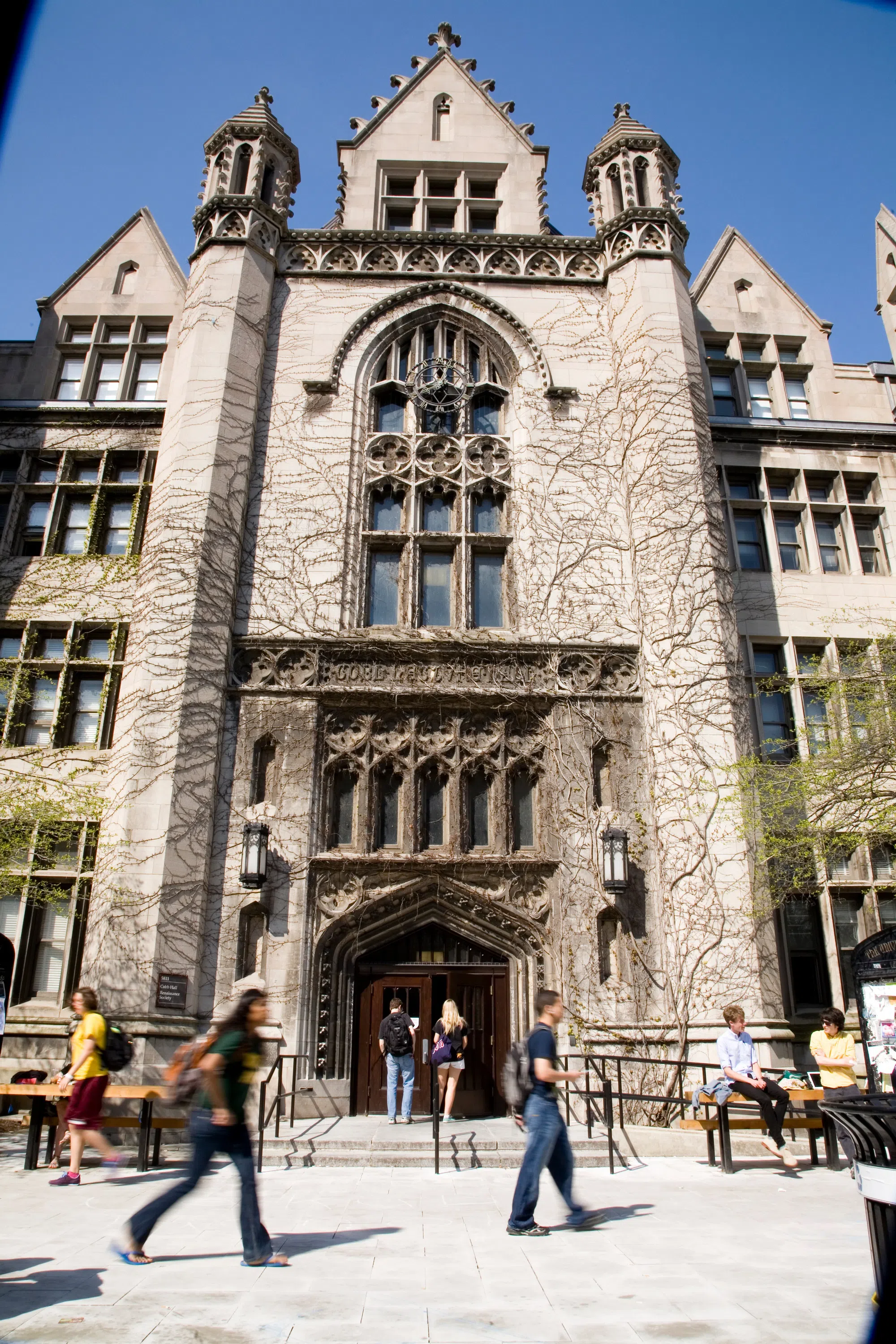 exterior of a campus building in a Gothic style, covered with ivy vines