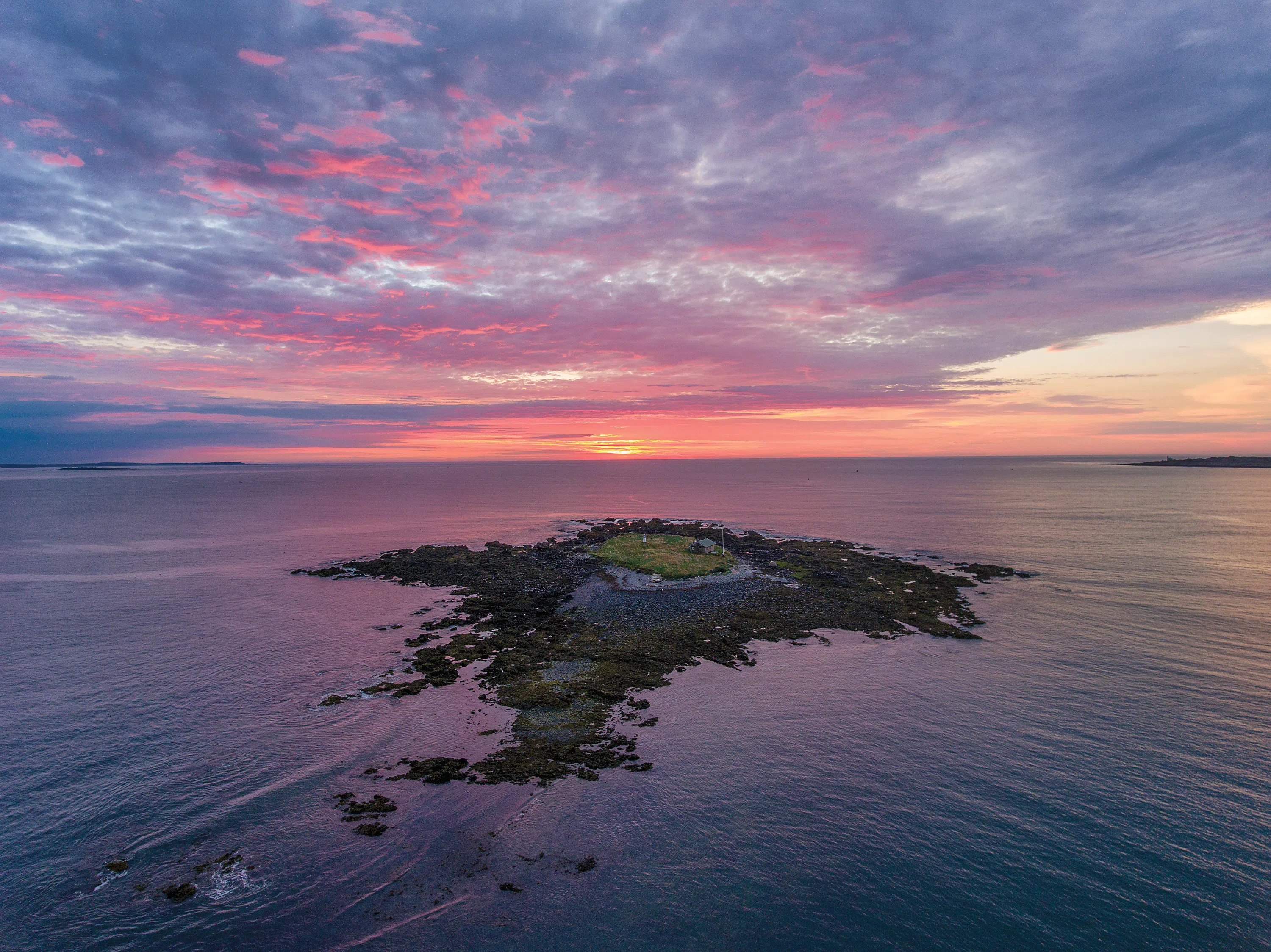 aerial view of an isolated island during the sunset
