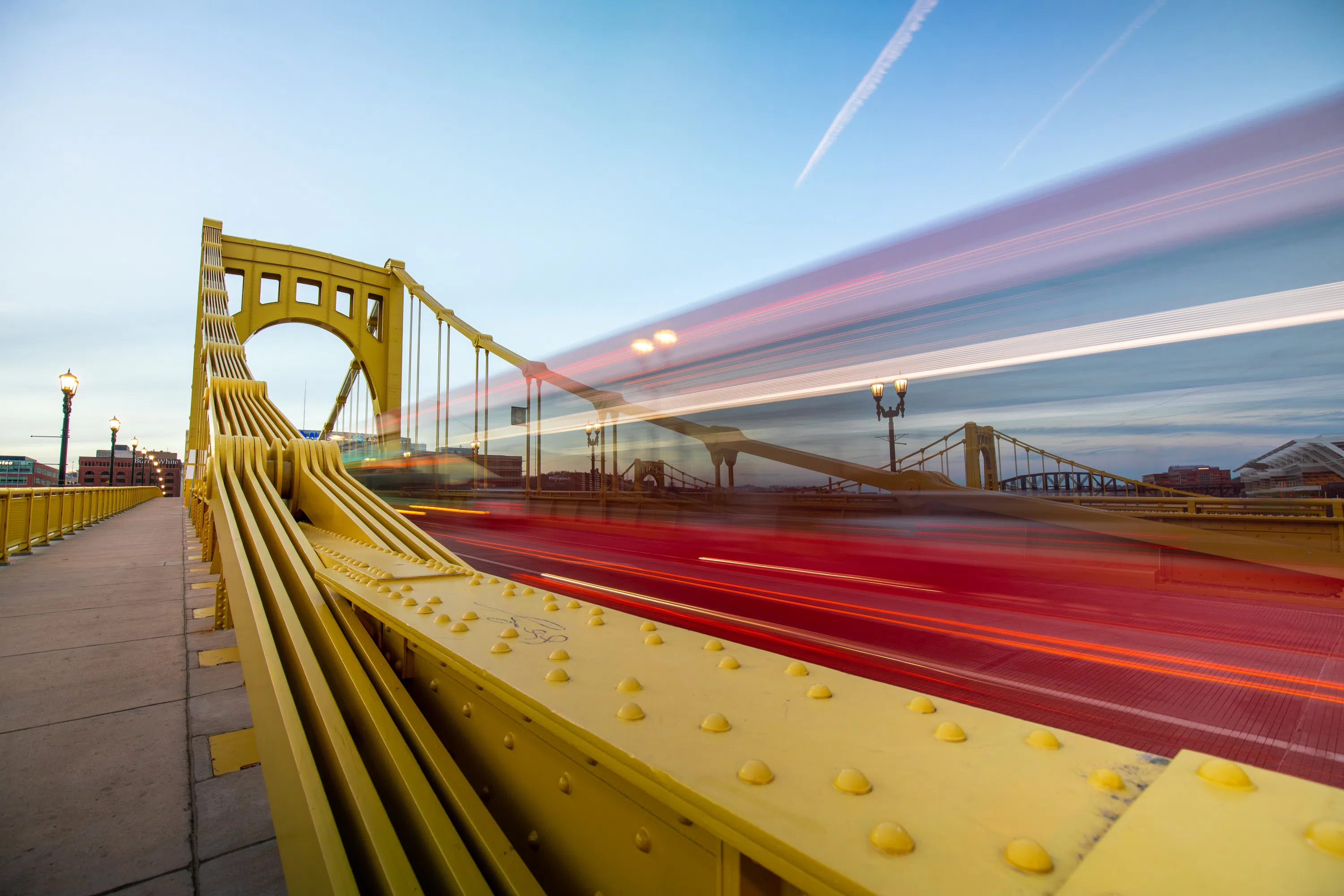 one of Pittsburgh's iconic bridges with traffic moving