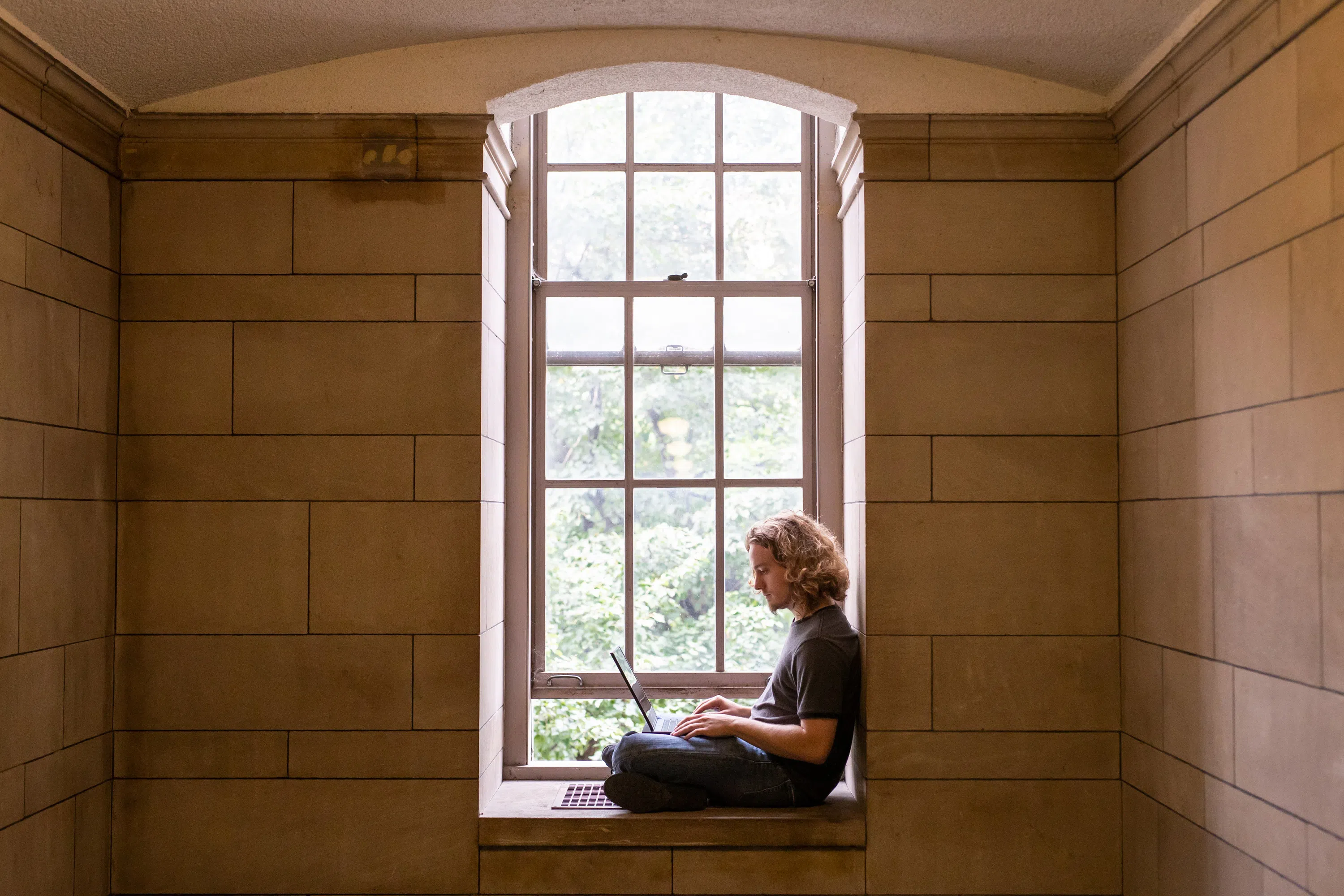Student studying in alcove in the Cathedral of Learning