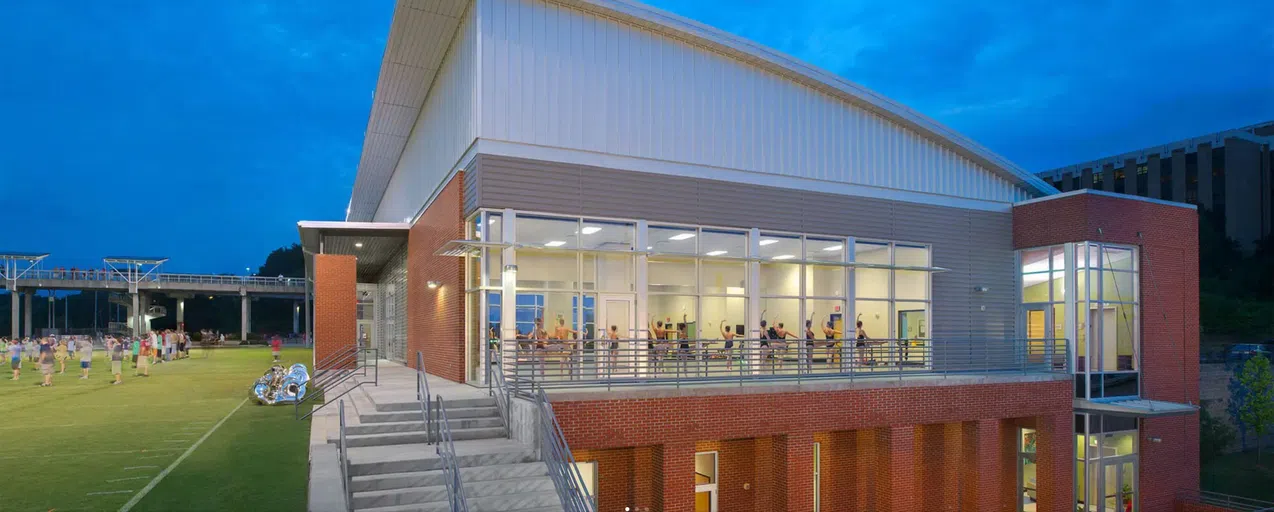 View of the front of the Band and Dance Facility at night.