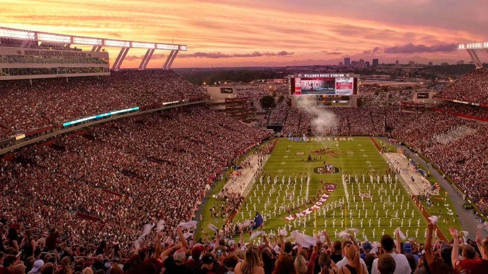 A beautiful sunset frames Williams-Brice Stadium during a game’s opening ceremonies.