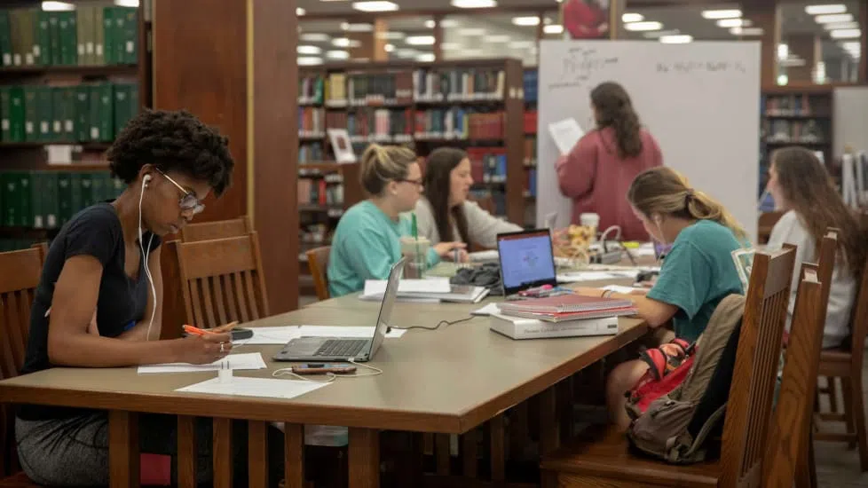 Students get busy during exam week, studying together in Thomas Cooper Library.