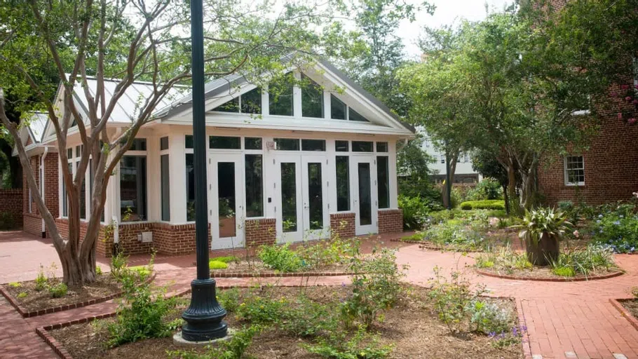 View of the Kennedy Greenhouse Studio and its surrounding garden