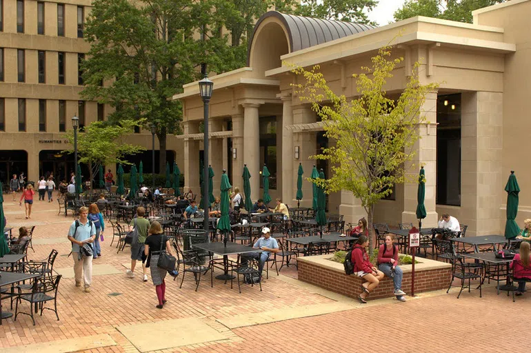 View of the front of the Colloquium Cafe during the day.