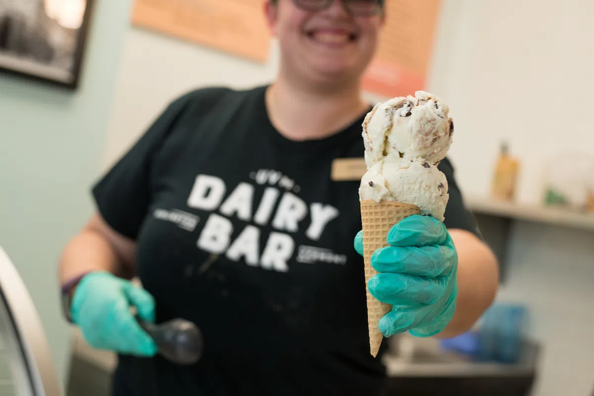 Student holding ice cream cone from the Dairy Bar
