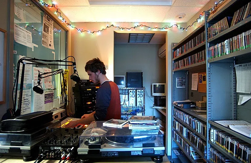 Student working in the WRUV radio office.