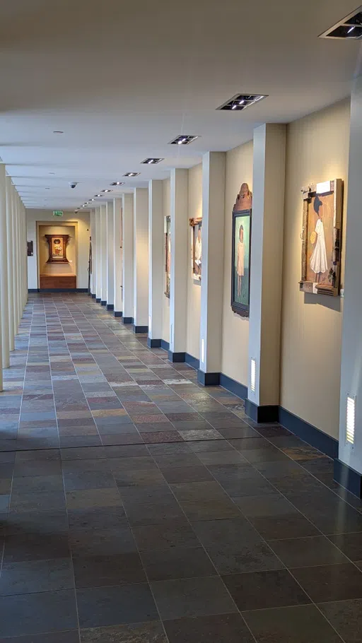 Interior photo of BCC showing the artway, a hallway featuring artwork