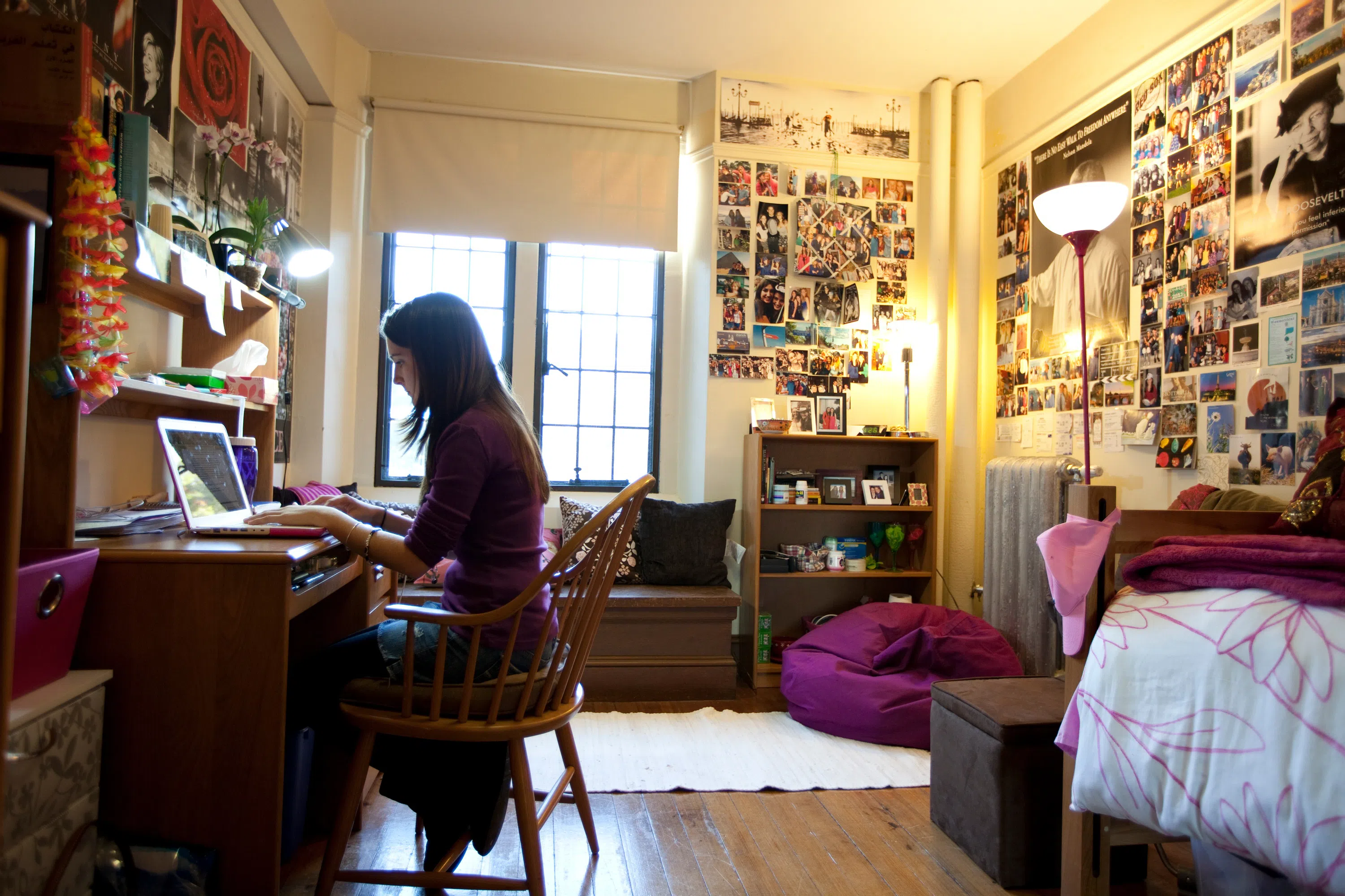 A Wellesley student studying inside her dorm
