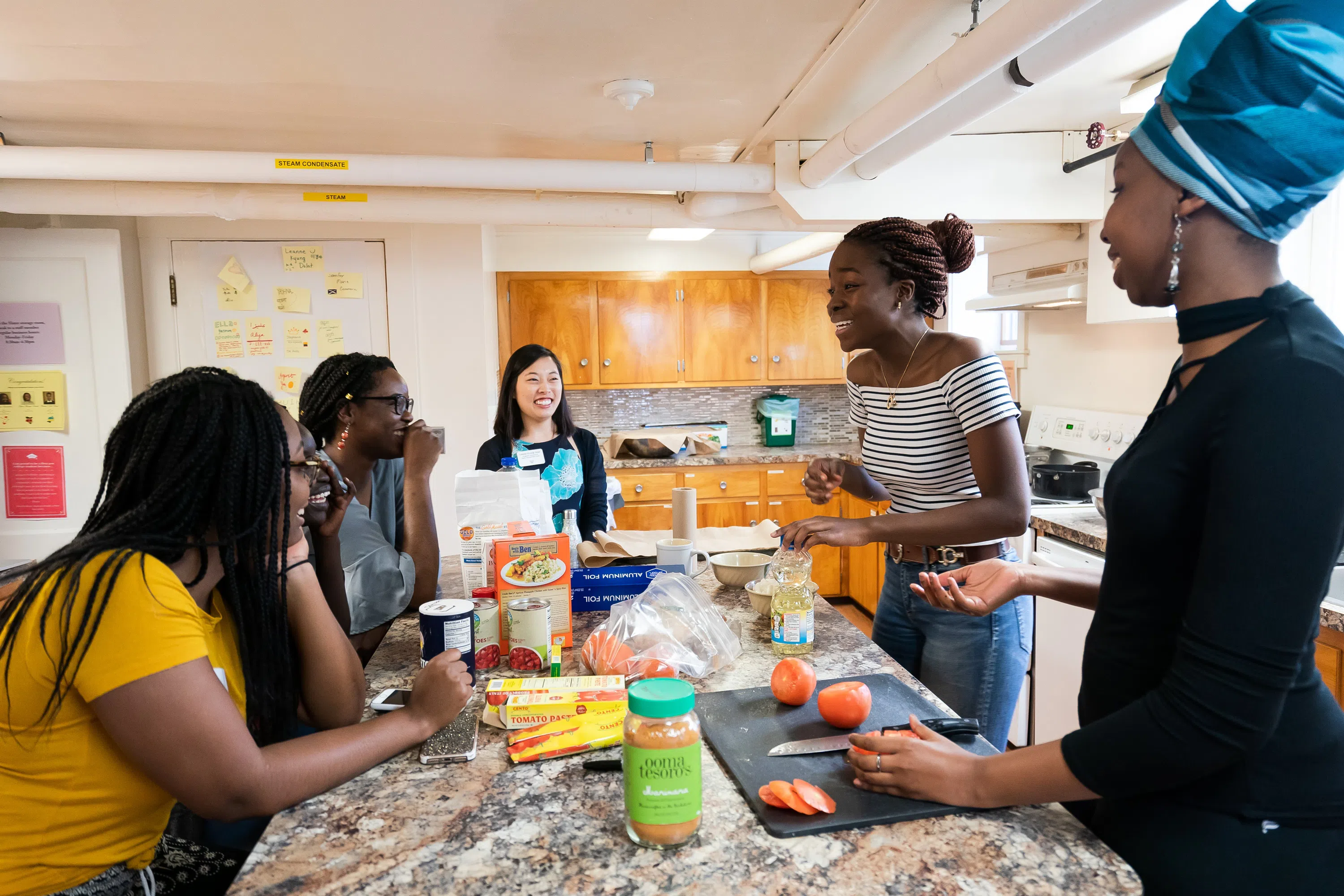 Wellesley students cooking in the Slater International Center kitchen