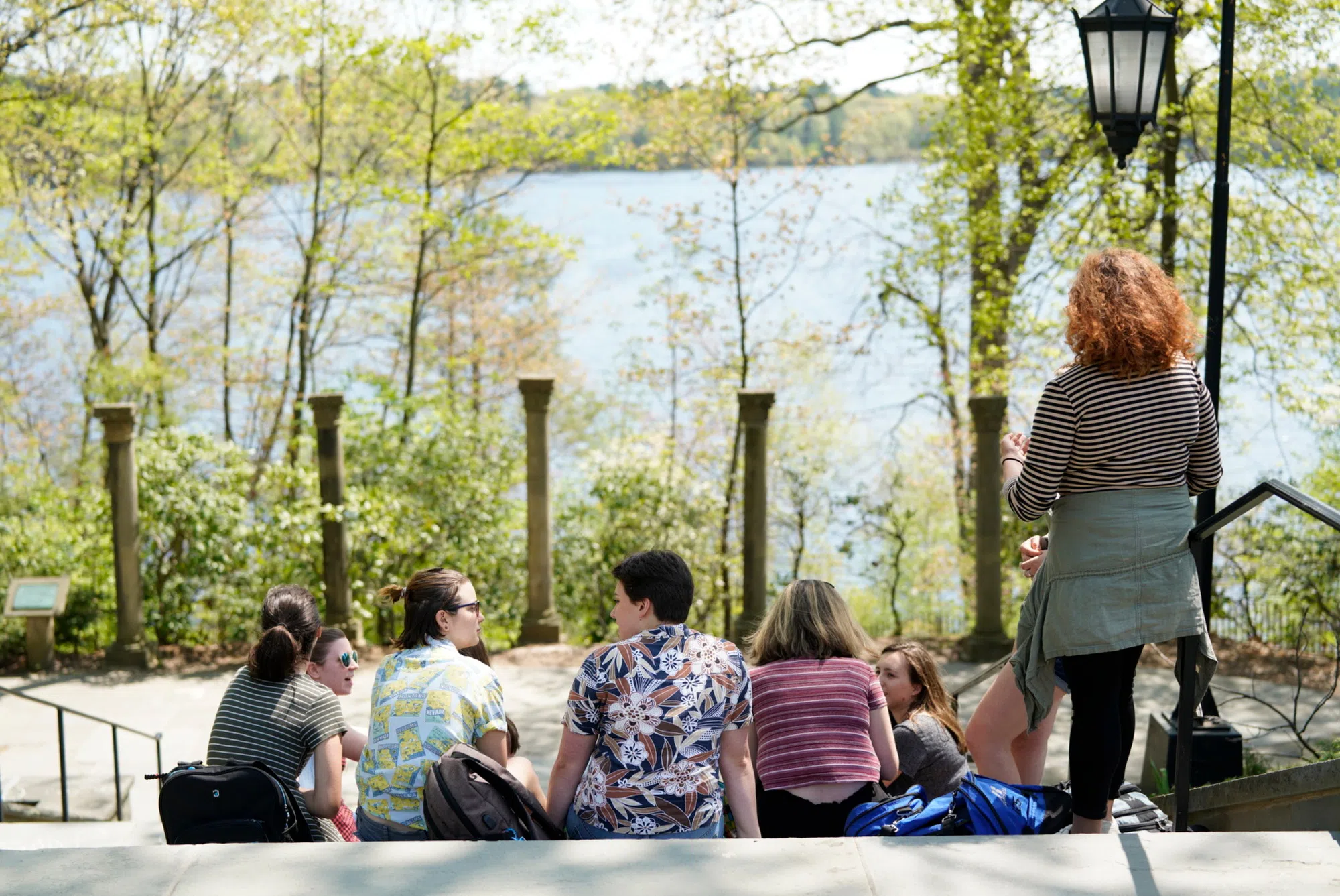 Wellesley students looking out at Lake Waban from Tower residential quad