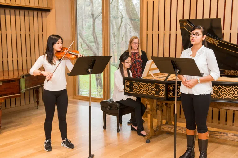 Wellesley students rehearsing in the Music Salon 