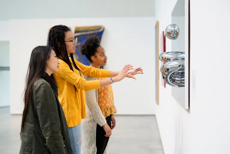 Wellesley students looking at art in the Davis Museum