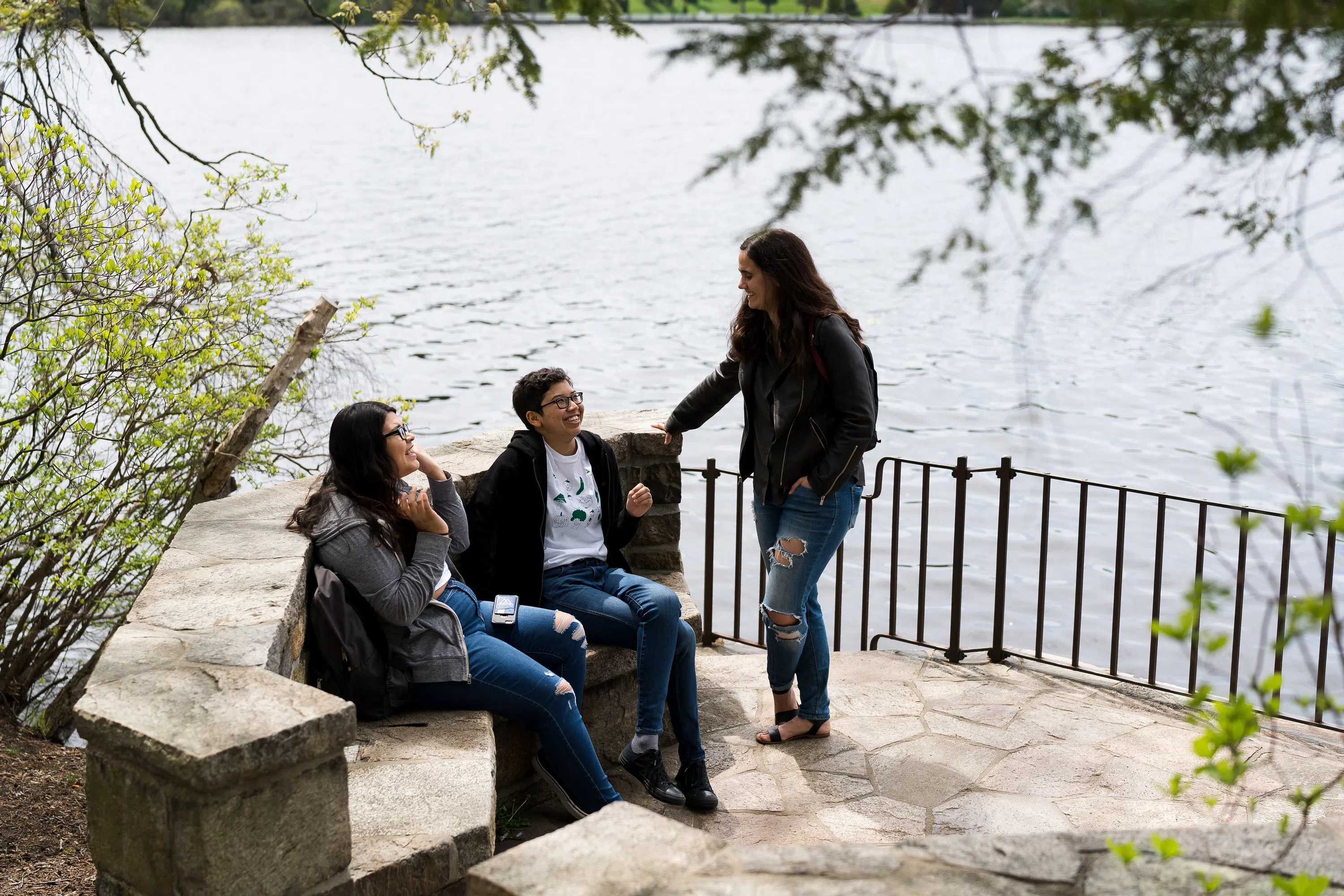 Wellesley students at Tupelo Point, an observation point on the shore of Lake Waban. 