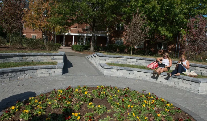 This image shows students lounging in the courtyard of centennial village.