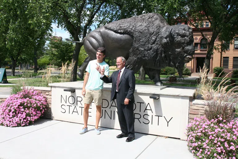 President Bresciani can be seen around campus and throwing up his horns for the occasional photo op.