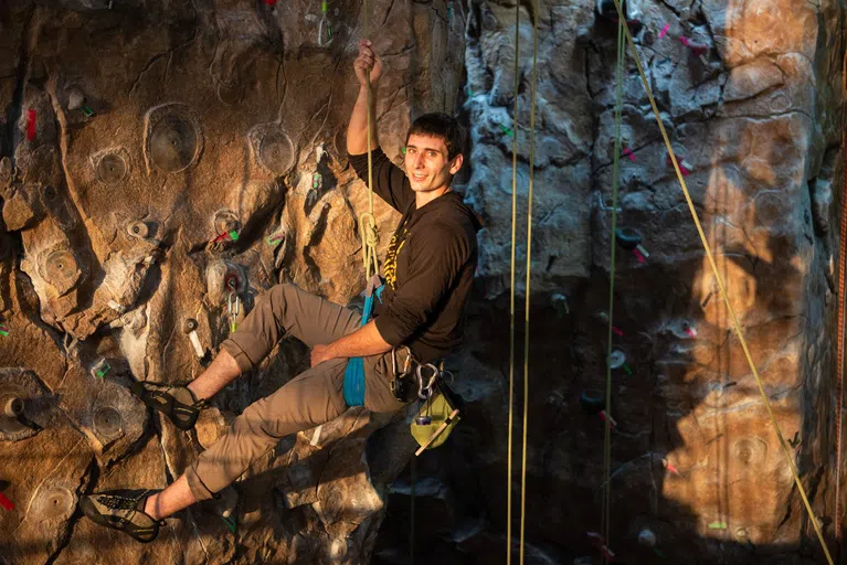 Climb to new heights at our rock-climbing wall located in the center of our Wellness Center!