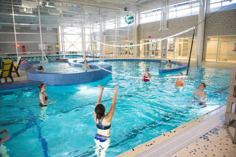 The Aquatic Facility, located in the Wallman Wellness Center, includes a lap pool, leisure pool and hot tub, wet classroom, locker rooms (men’s, women’s, and gender-neutral), a sauna, and fire pit.